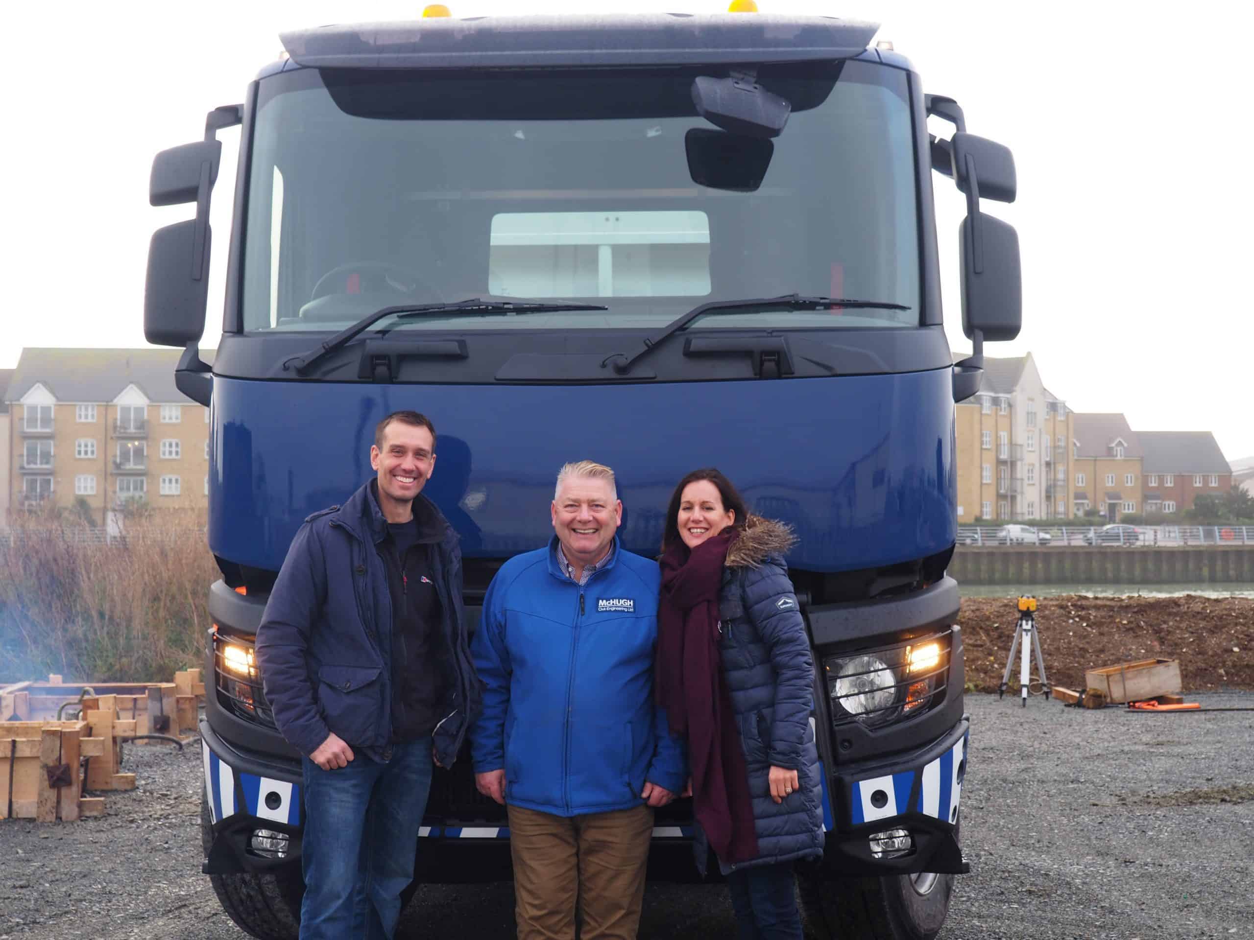 Rob Sean and Claire in front of a McHugh Lorry